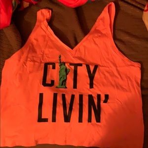 PINK cropped tank “city livin’” size L